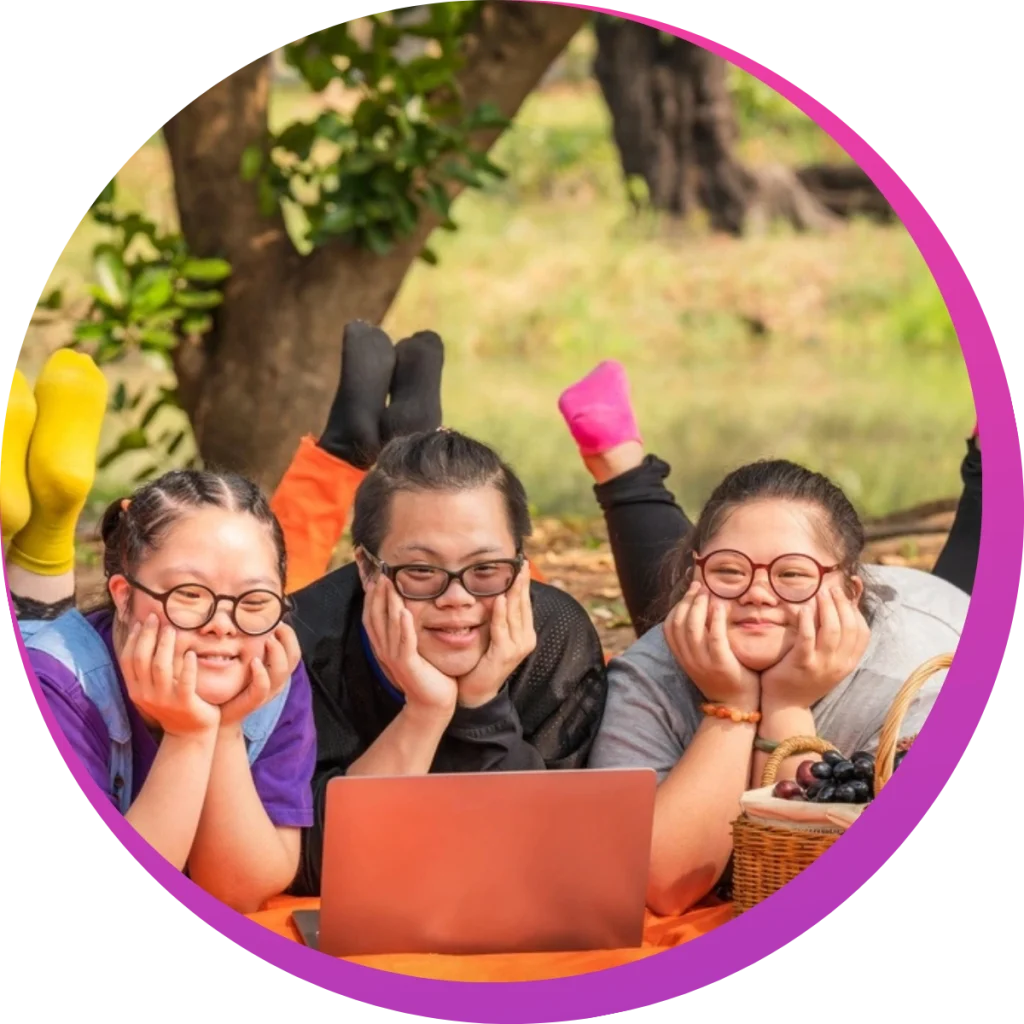 three disabled girls watching movie in a picnic