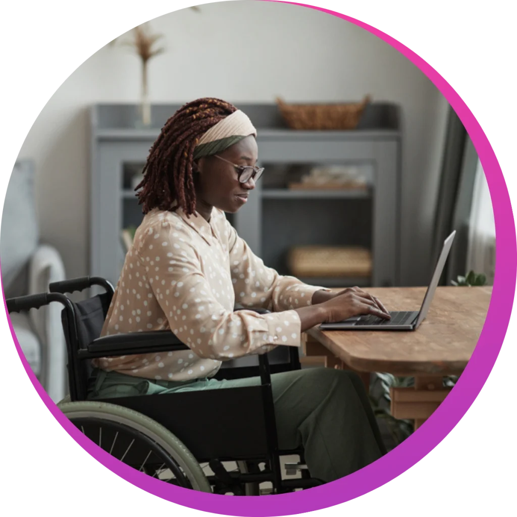 a woman in wheel chair working