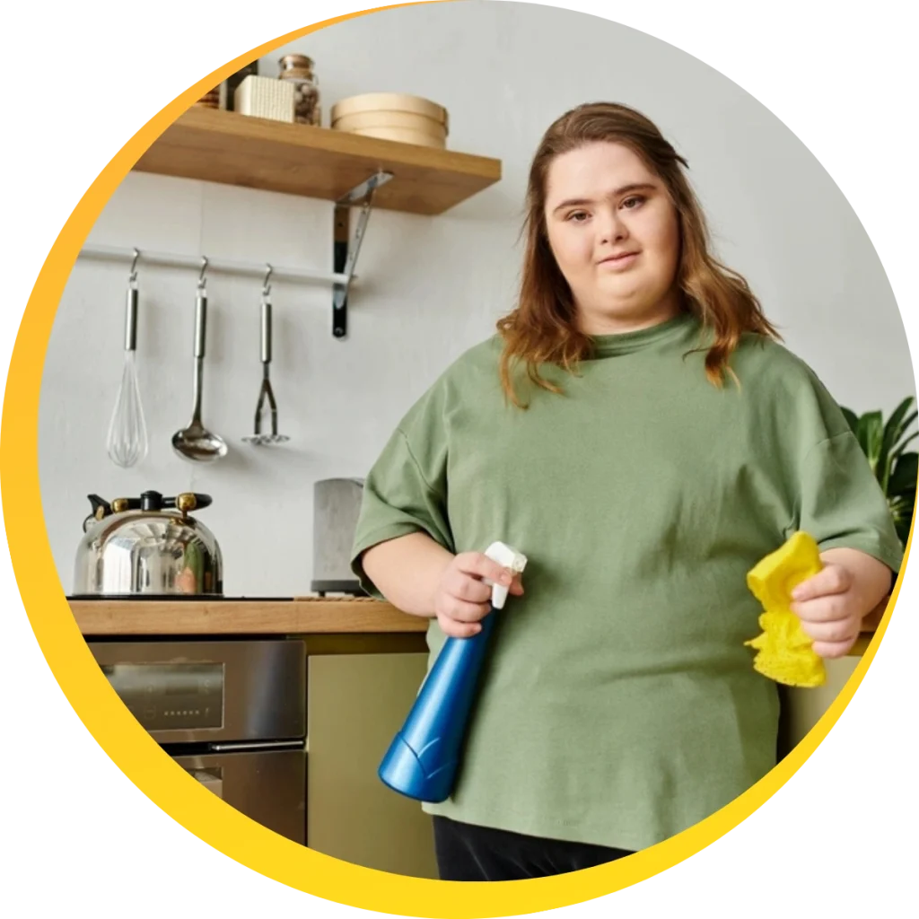 woman with down syndrome cleaning kitchen
